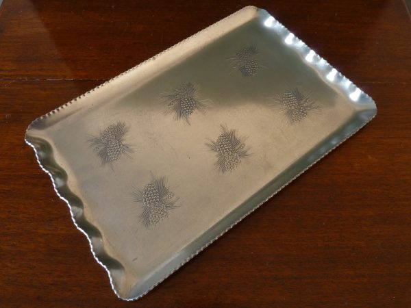 Aluminium tray with impressed pine cone design