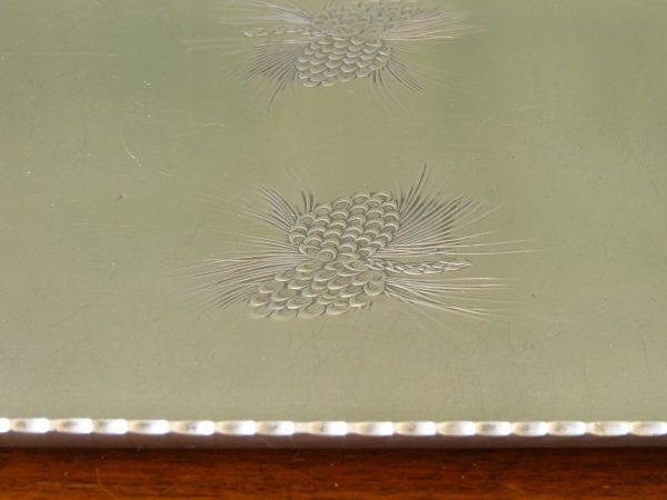 Aluminium tray with impressed pine cone design