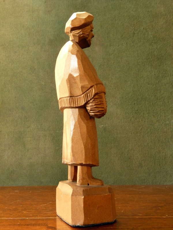 Caron carved wood figure of an old woman