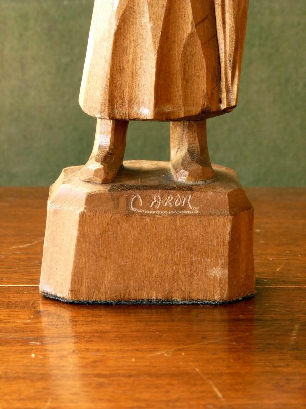 Caron carved wood figure of an old woman