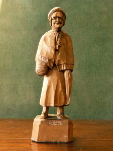 Caron carved wood figure of an old woman