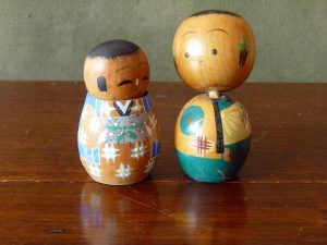 A pair of vintage wooden bobble head Kokeshi Dolls