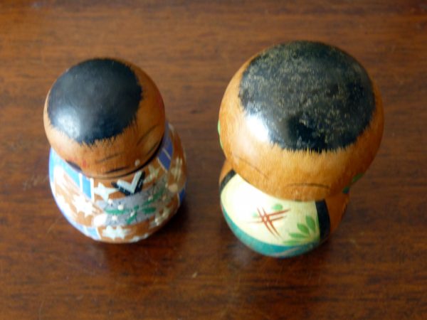 A pair of vintage wooden bobble head Kokeshi Dolls