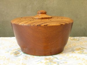 Turned wood pot pourri bowl with contrasting grain