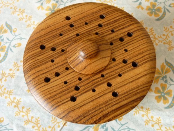 Turned wood pot pourri bowl with contrasting grain