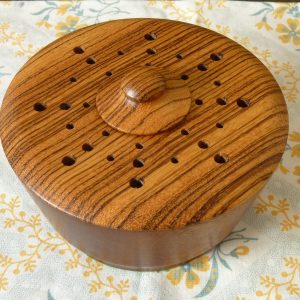 Turned wood pot pourri bowl with contrasting grain