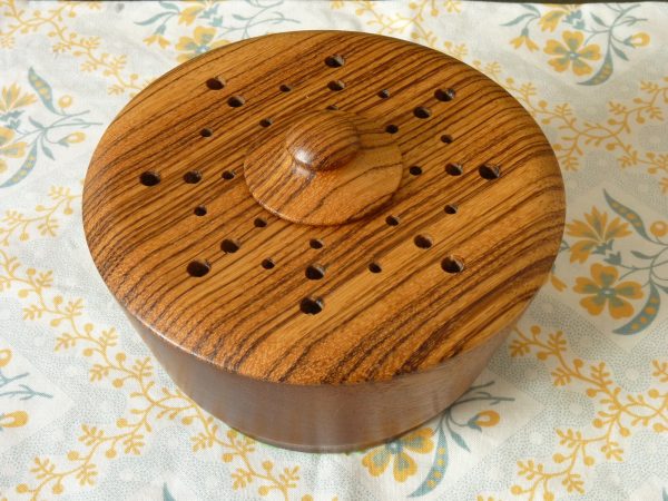 Turned wood pot pourri bowl with contrasting grain